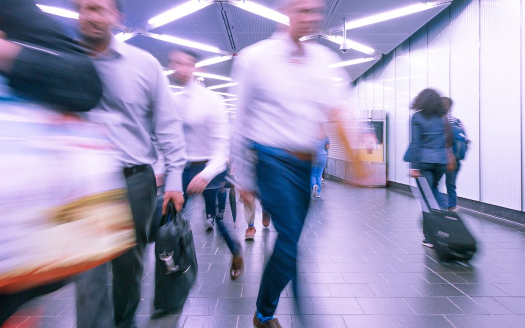 people walking inside white hall